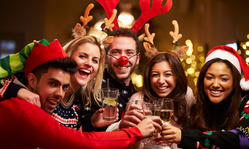 Friends cheering during the holidays.